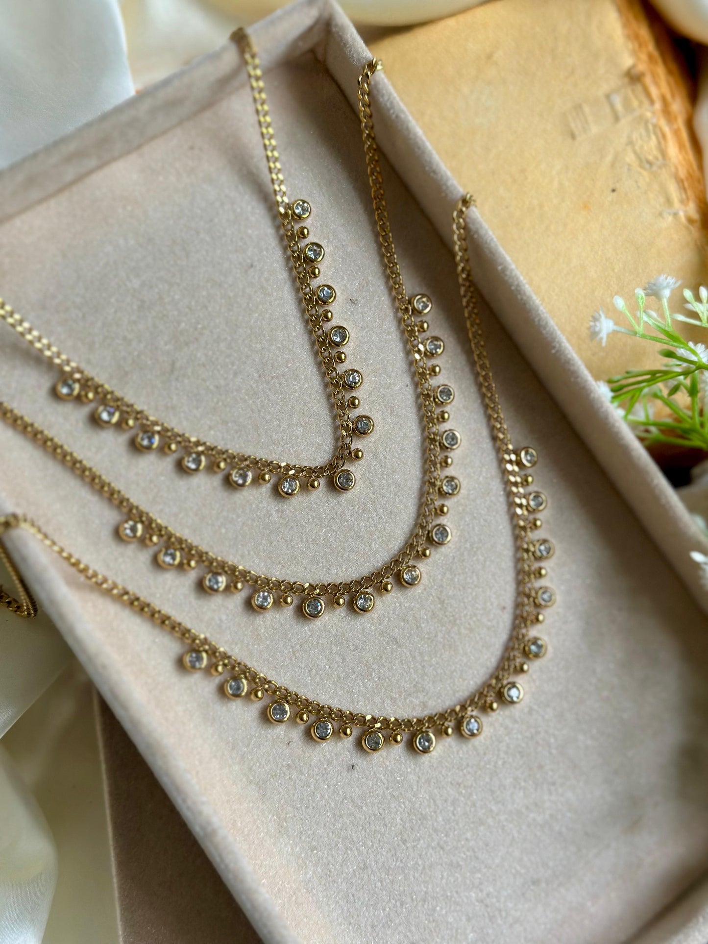 White stoned charm necklace